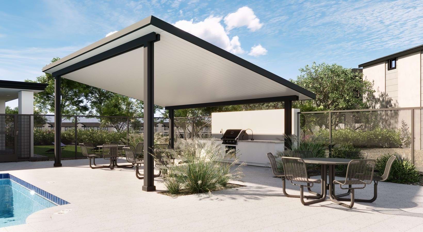 Covered poolside patio with table and chairs